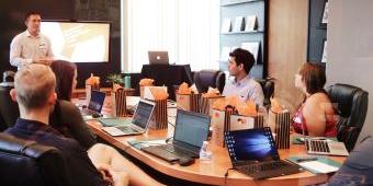 people sitting around a conference table