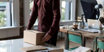 person preparing a package for shipment