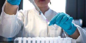 person working with test tubes